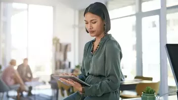 Business woman using tablet in office