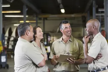 Group of employees meeting in a warehouse