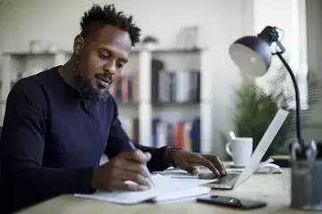 Guy at desk with lamp