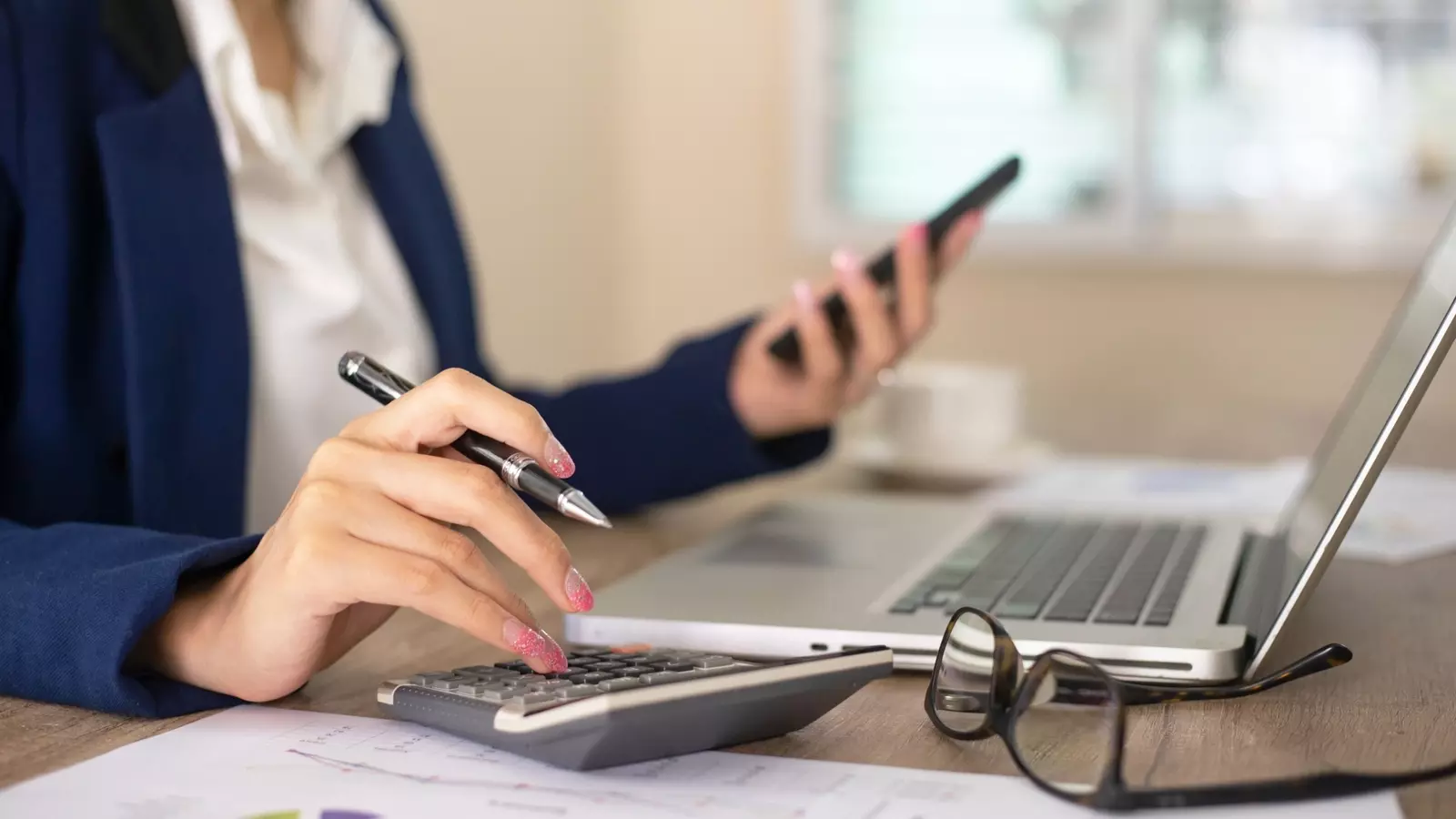 business woman working with calculator