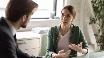 A manager conducting a stay interview with an employee