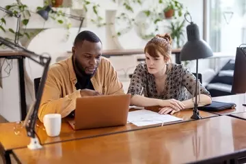 Two employees working together