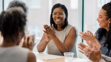 Coworkers celebrate pay equity in the workplace